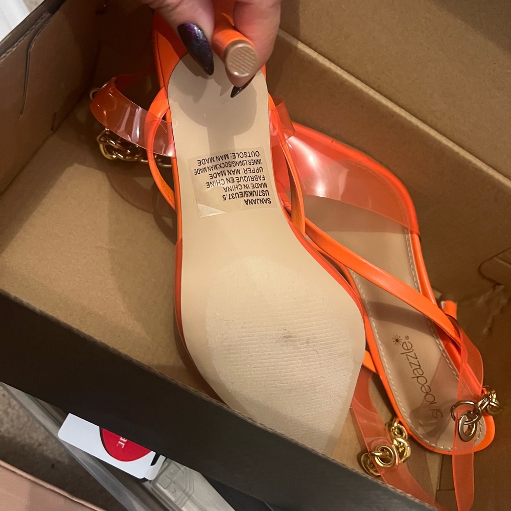 Orange sling back shows with chain